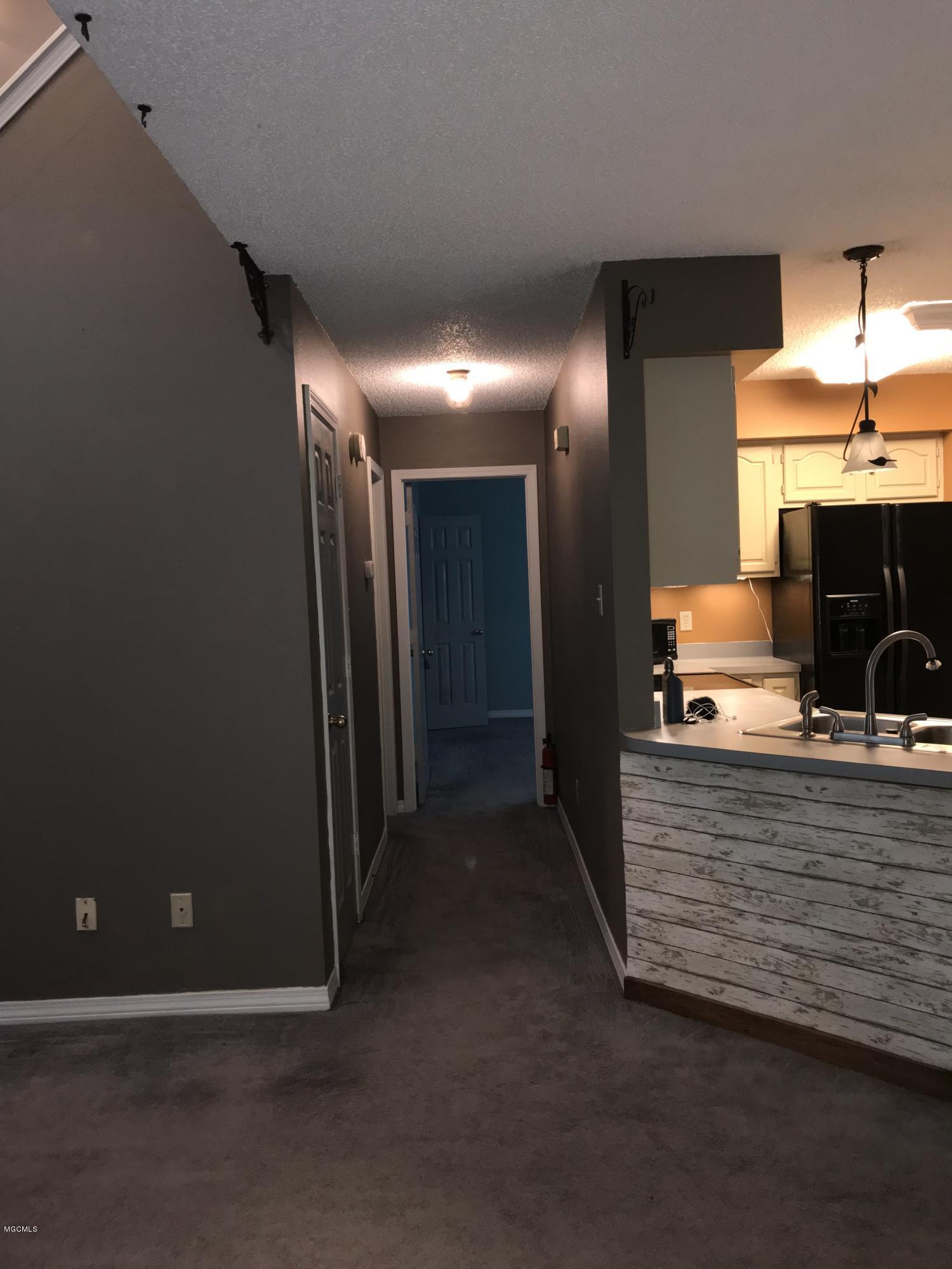 9420 Pointe Aux Chenes Road Ocean Springs, MS 39564 - Photo 10 of 30 First floor hallway