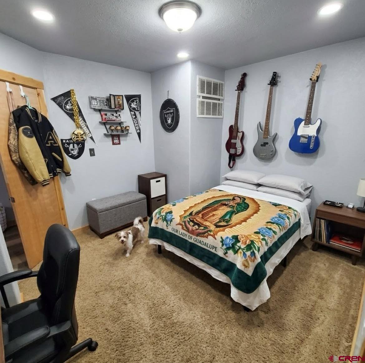 816 Main Street Manassa, CO 81141 - Photo 12 of 23 a bedroom with bed and a mirror