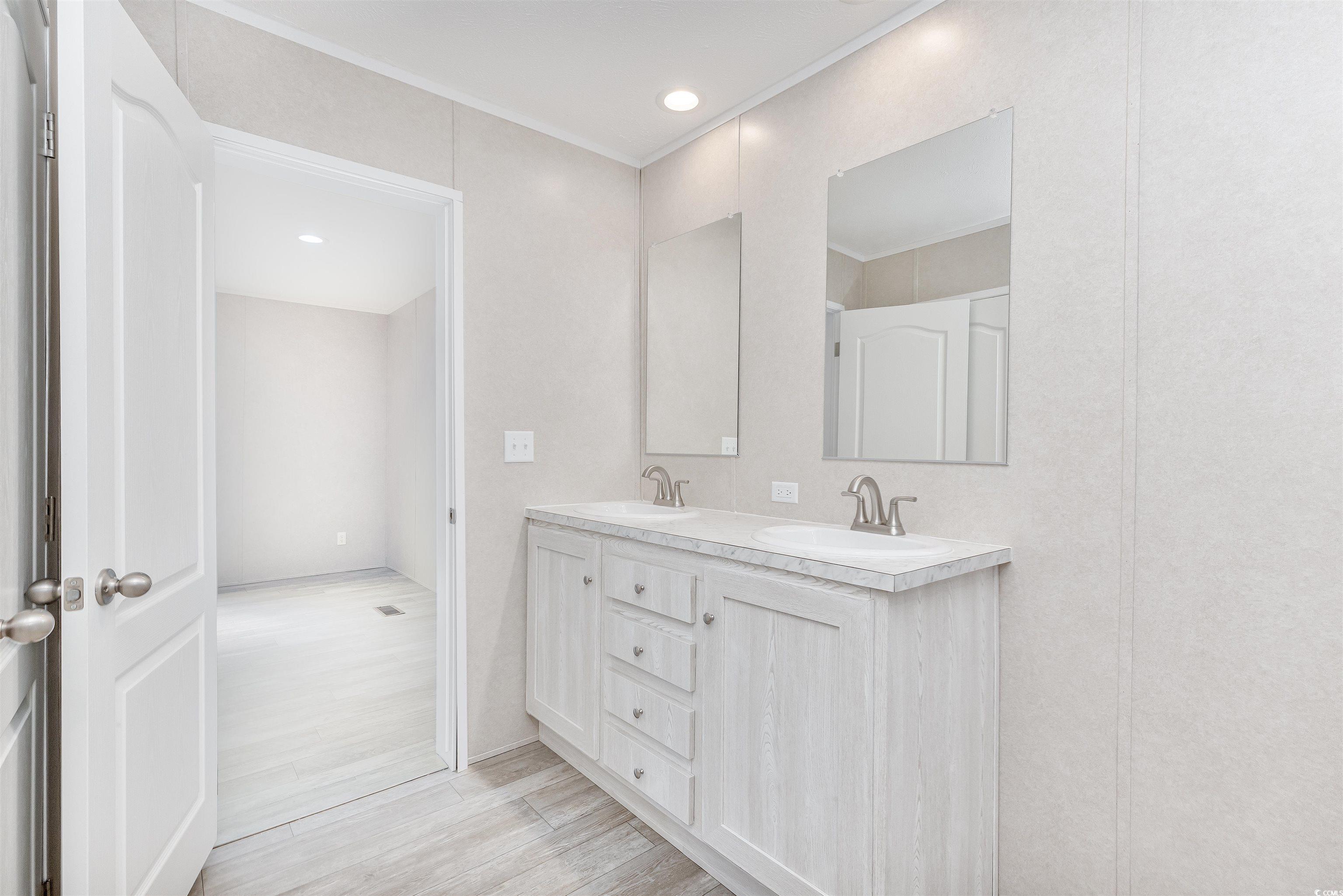 398 West Canal Street Murrells Inlet, SC 29576 - Photo 17 of 40 Bathroom with vanity and hardwood / wood-style flo