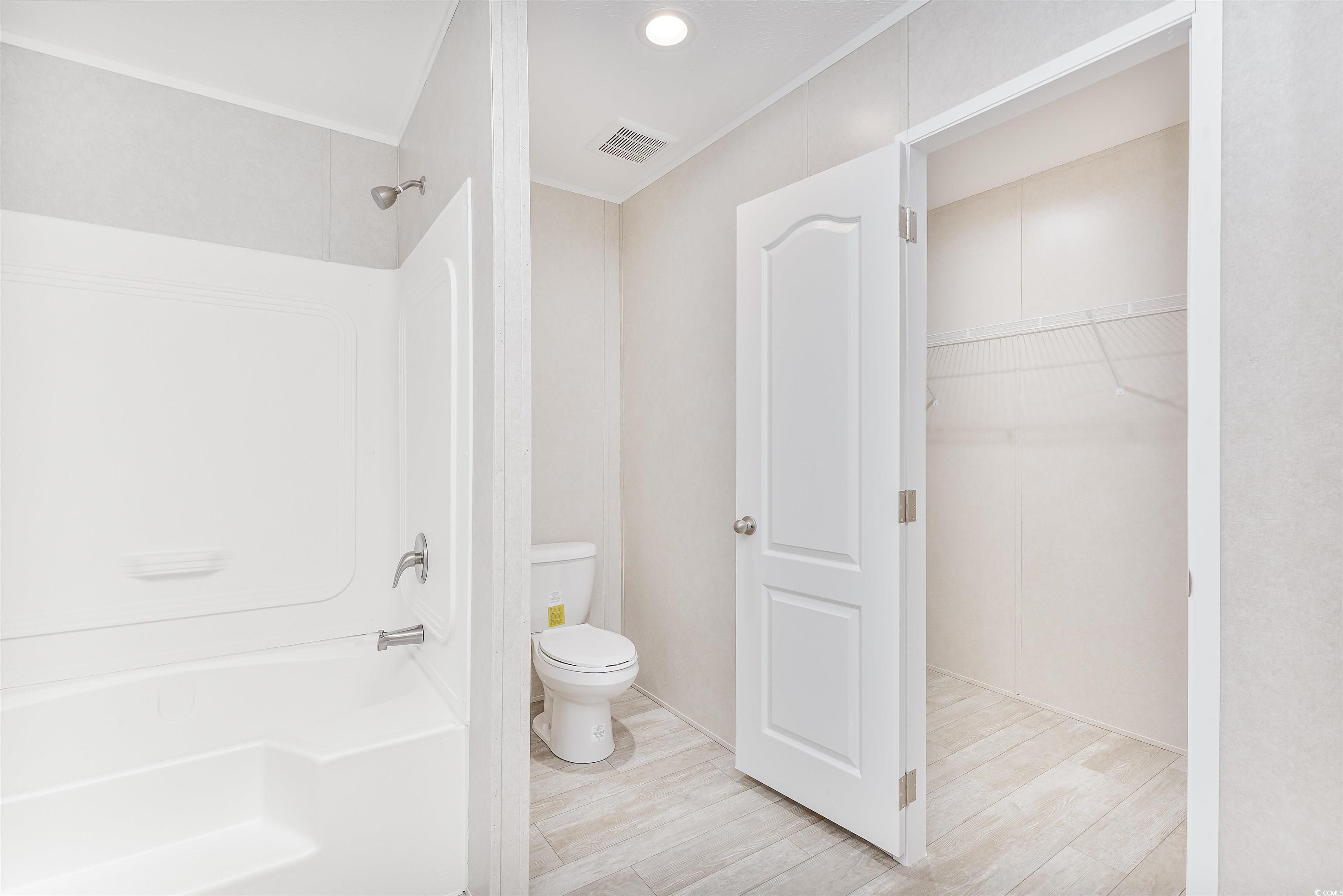 398 West Canal Street Murrells Inlet, SC 29576 - Photo 19 of 40 Bathroom featuring toilet, hardwood / wood-style f