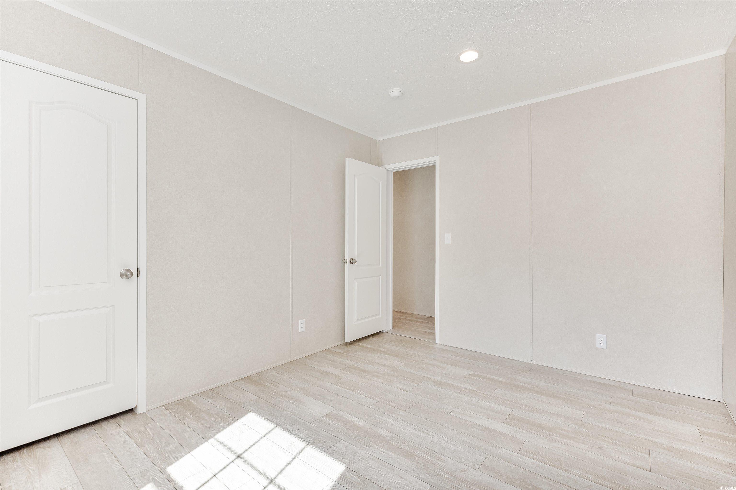 398 West Canal Street Murrells Inlet, SC 29576 - Photo 22 of 40 Spare room featuring light hardwood / wood-style f