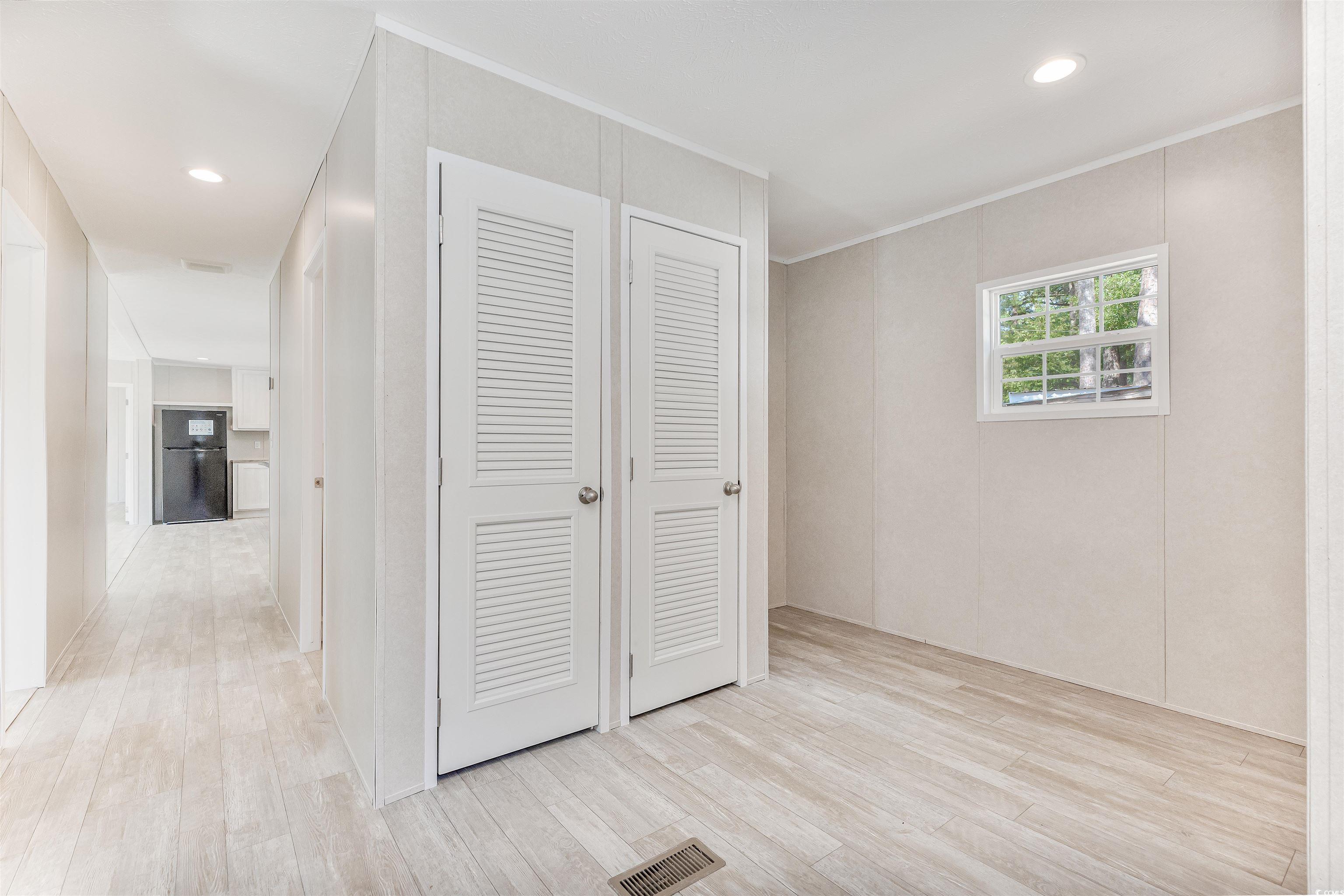 398 West Canal Street Murrells Inlet, SC 29576 - Photo 24 of 40 Corridor with light hardwood / wood-style floors a