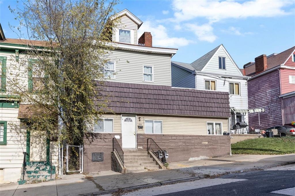 403 Ormsby Avenue Pittsburgh, PA 15210 - Photo 2 of 32 a front view of a house with garden