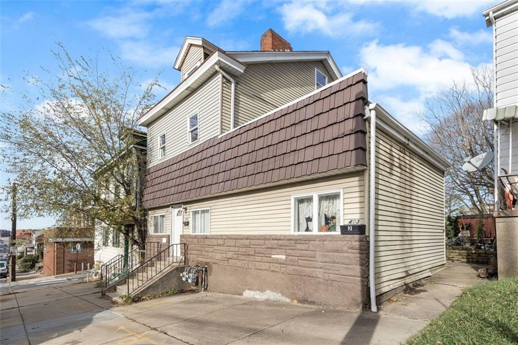 403 Ormsby Avenue Pittsburgh, PA 15210 - Photo 3 of 32 a view of a house with a yard