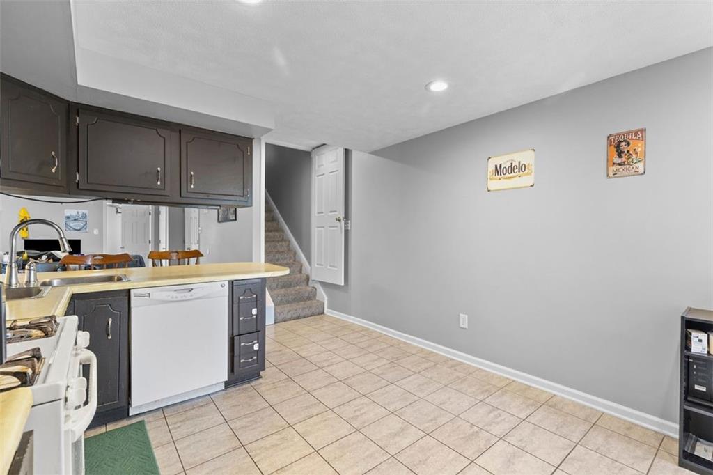 403 Ormsby Avenue Pittsburgh, PA 15210 - Photo 9 of 32 a kitchen with a cabinets and window