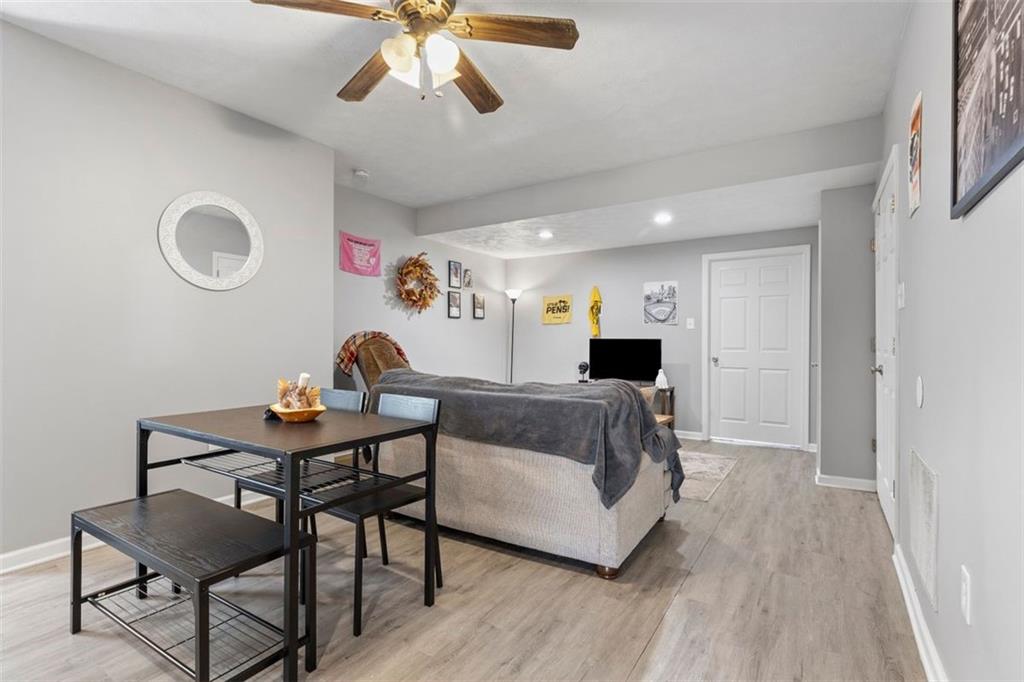403 Ormsby Avenue Pittsburgh, PA 15210 - Photo 10 of 32 a living room with furniture and a wooden floor