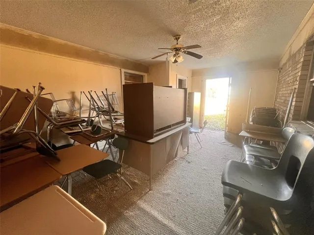 a kitchen with refrigerator and window
