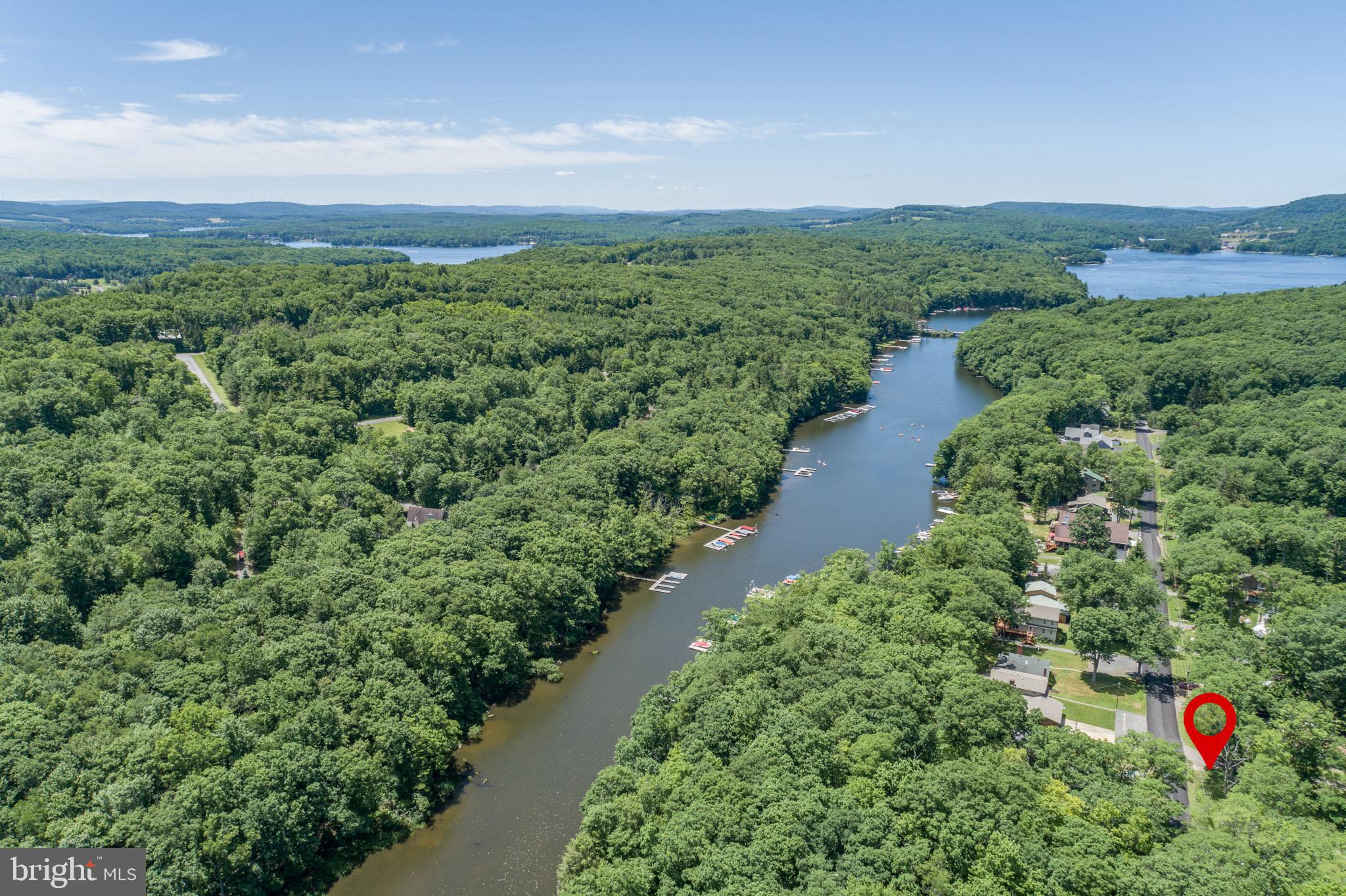 509 Brant Road Swanton, MD 21561 - Photo 3 of 21 a view of a lake with a building in the background