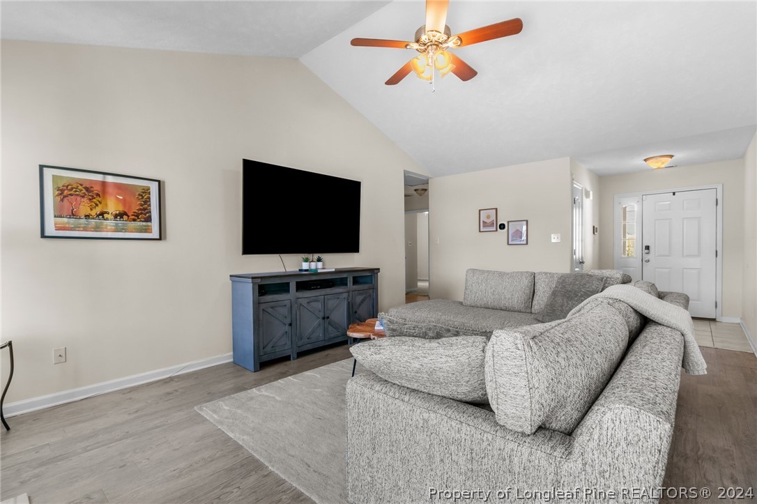 1949 Yellowbrick Road Fayetteville, NC 28314 - Photo 11 of 34 a living room with furniture and a flat screen tv