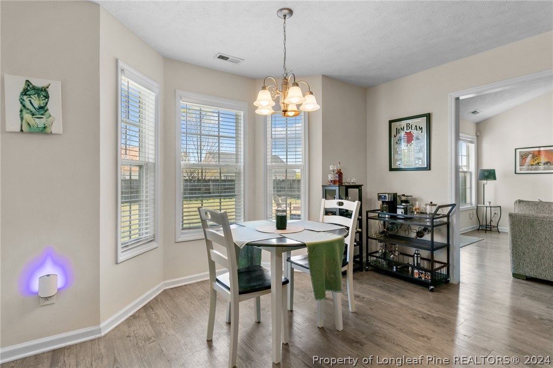 1949 Yellowbrick Road Fayetteville, NC 28314 - Photo 16 of 34 a view of a dining room with furniture window and outside view