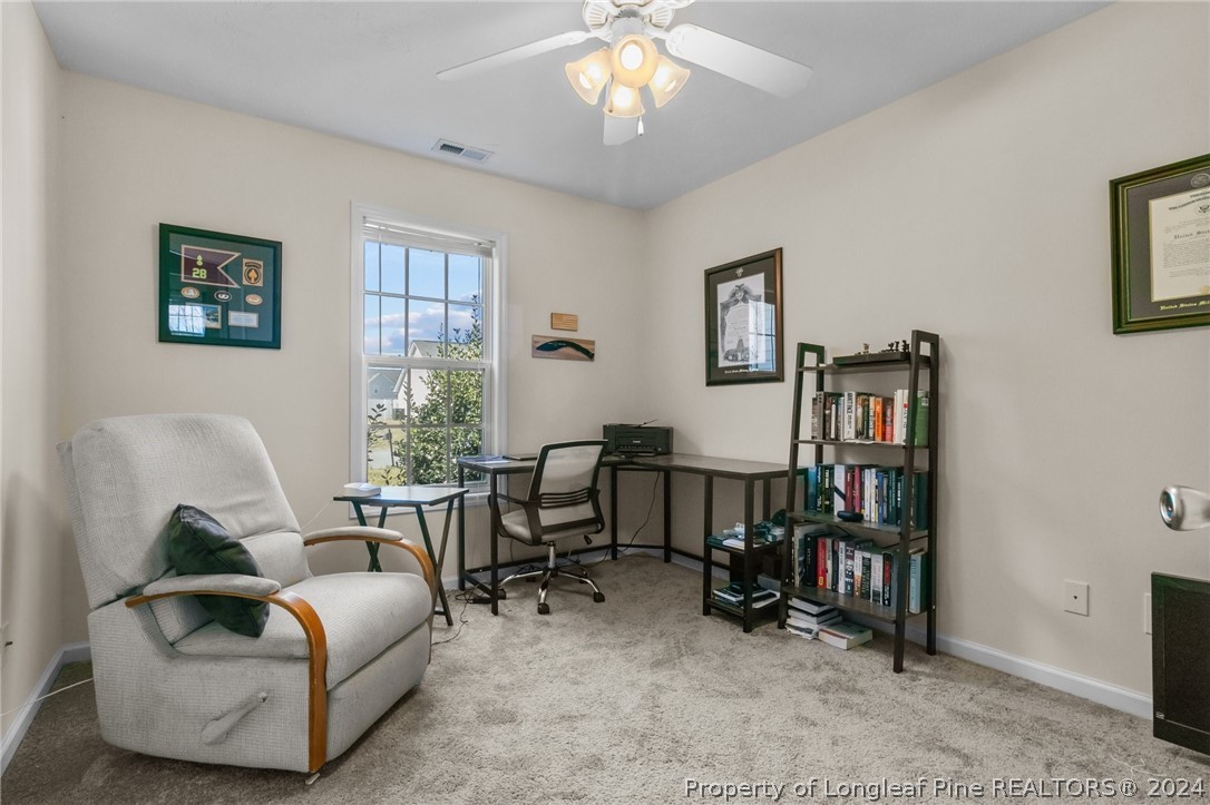 1949 Yellowbrick Road Fayetteville, NC 28314 - Photo 18 of 34 a living room with furniture and a window
