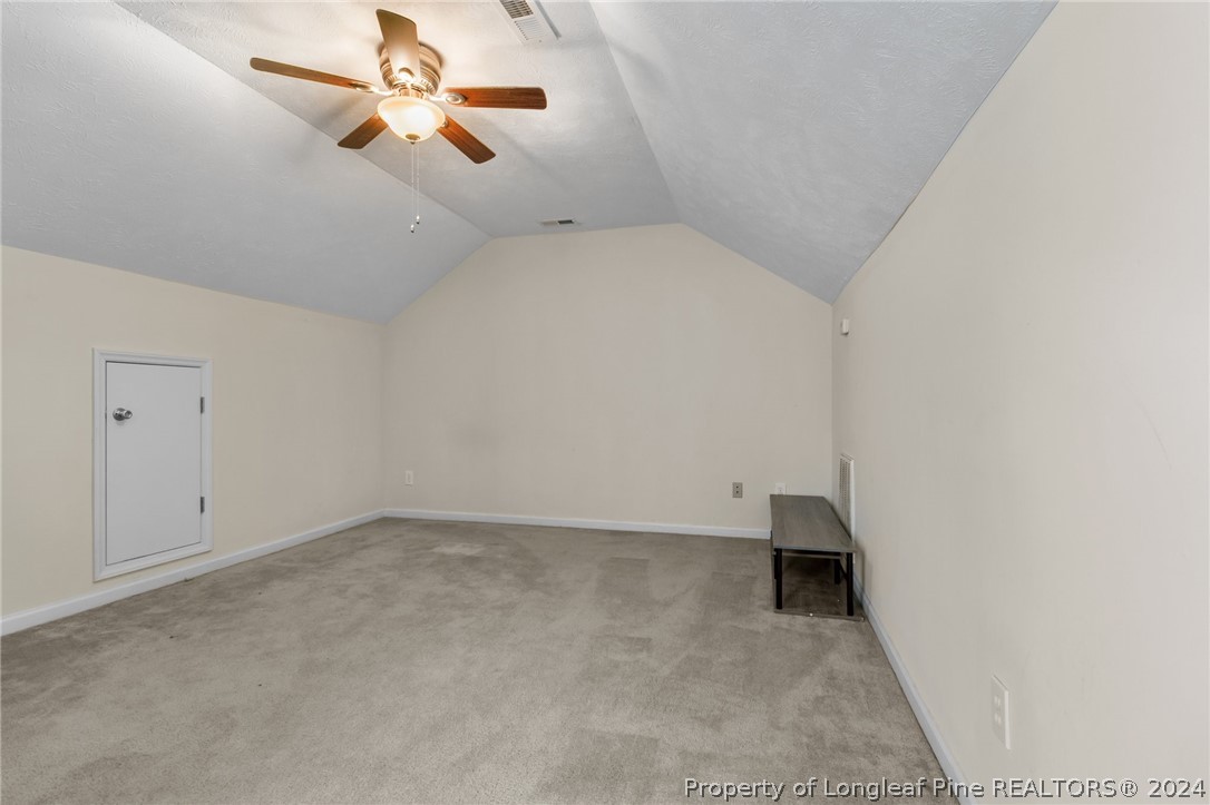 1949 Yellowbrick Road Fayetteville, NC 28314 - Photo 26 of 34 an empty room with a ceiling fan and a ceiling fan