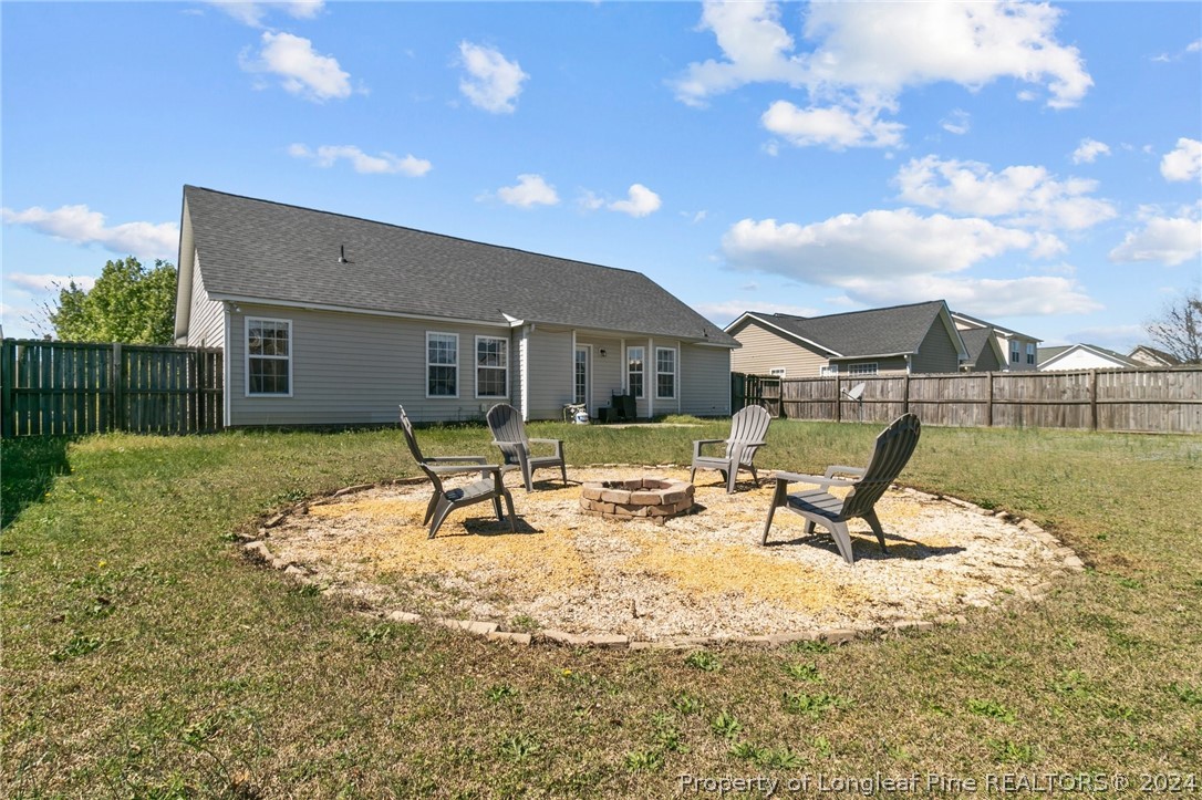 1949 Yellowbrick Road Fayetteville, NC 28314 - Photo 28 of 34 a view of a house with backyard porch and sitting area