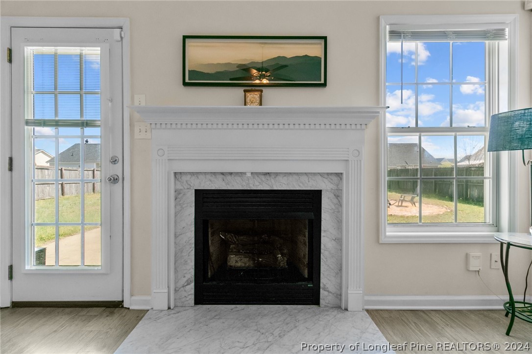1949 Yellowbrick Road Fayetteville, NC 28314 - Photo 10 of 34 a living room with a fireplace and a window