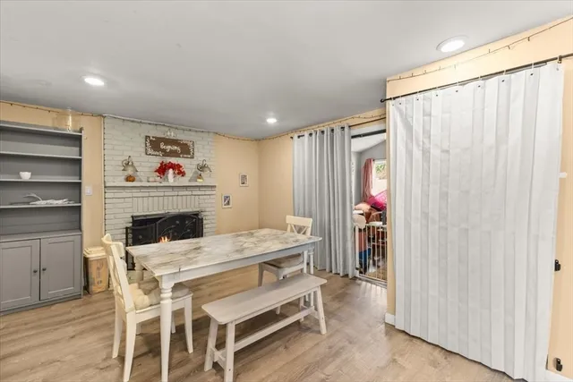 a dining room with furniture and window