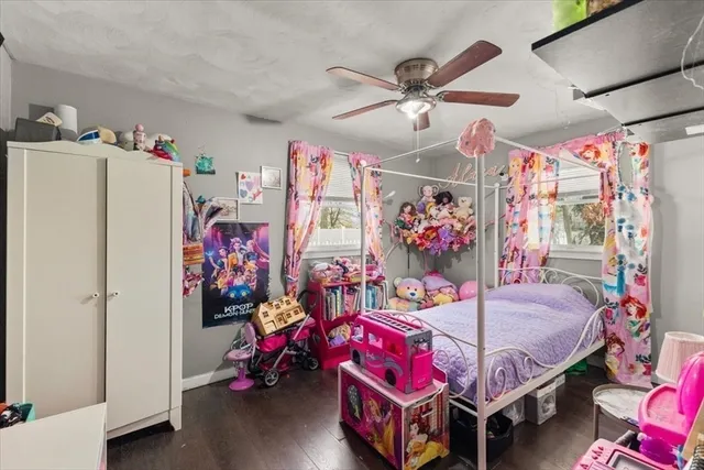 a bedroom with furniture and a chandelier