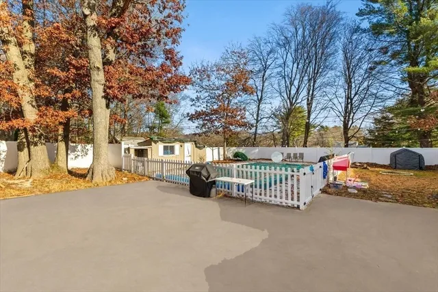 a view of street with trees and sitting area
