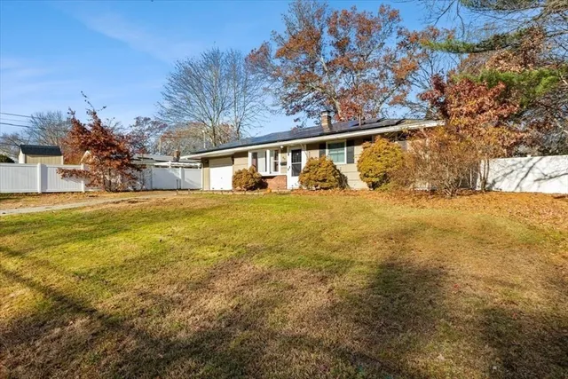 a view of a house with a yard