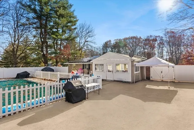 a view of a house with a porch and furniture