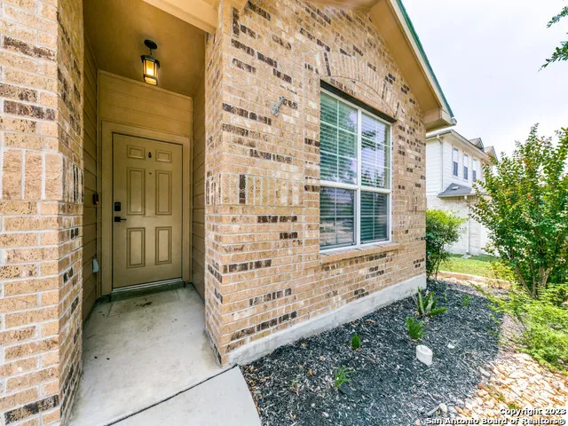 front view of a brick house with a large door