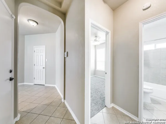 a view of a bathroom from the hallway