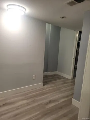 a view of small space with wooden floor