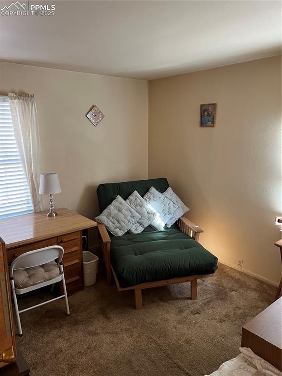 1041 Florence Avenue Colorado Springs, CO 80905 - Photo 20 of 27 Bathroom with combined bath / shower with glass door, tile walls, vanity, and light tile patterned floors