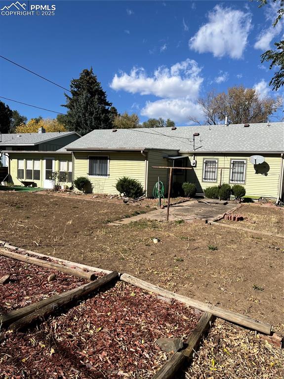 1041 Florence Avenue Colorado Springs, CO 80905 - Photo 5 of 27 Fenced backyard with view of wooded area