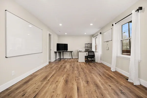 a view of kitchen with furniture and wooden floor