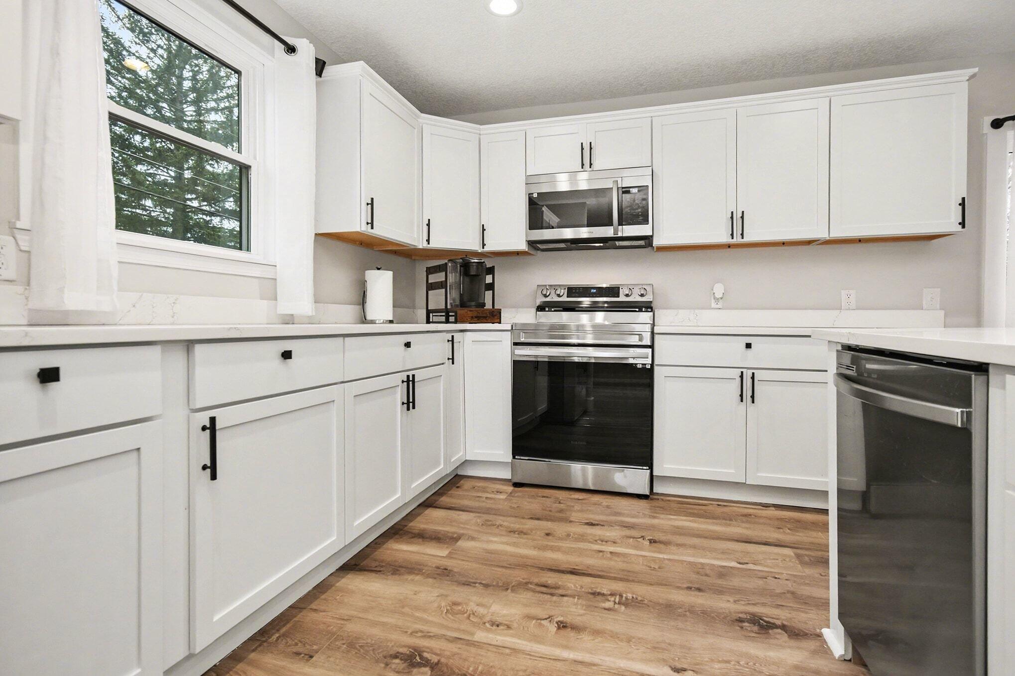 5317 Stellhorn Road Fort Wayne, IN 46815 - Photo 16 of 29 a kitchen with white cabinets and white appliances