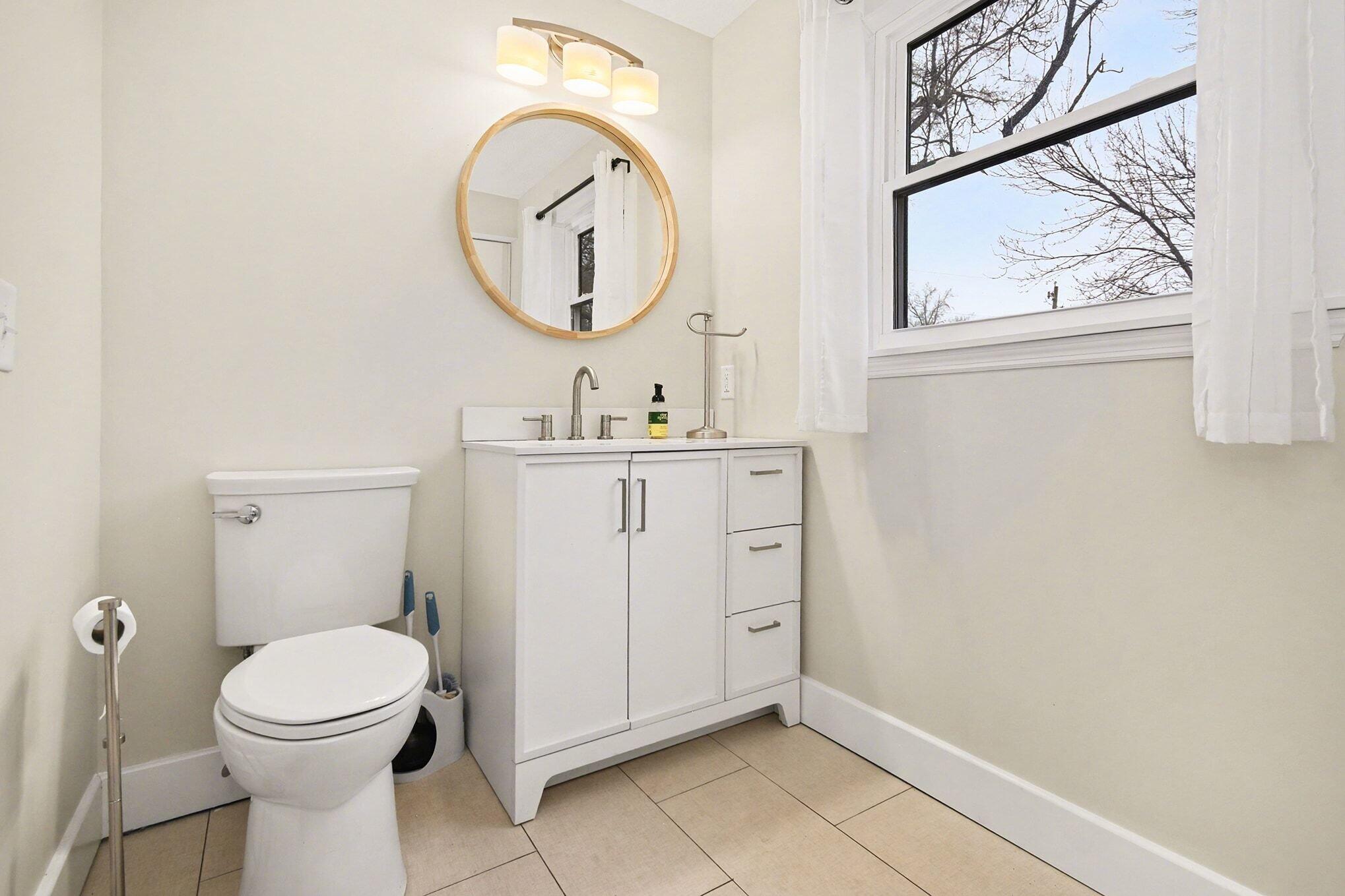 5317 Stellhorn Road Fort Wayne, IN 46815 - Photo 18 of 29 a bathroom with a toilet a sink and a mirror