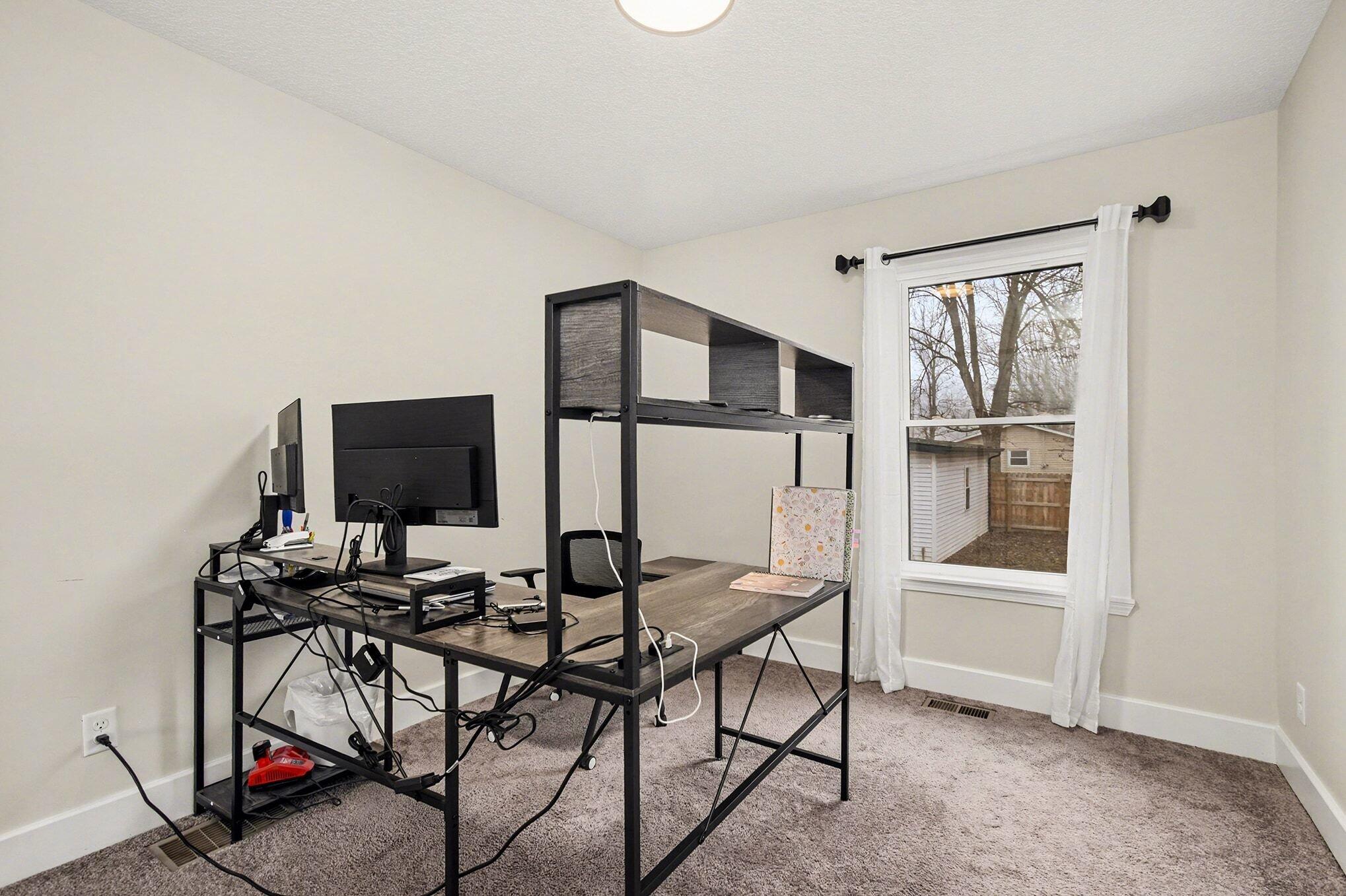 5317 Stellhorn Road Fort Wayne, IN 46815 - Photo 19 of 29 a view of a livingroom with furniture and a window