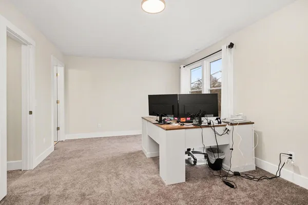 an empty room with closet area