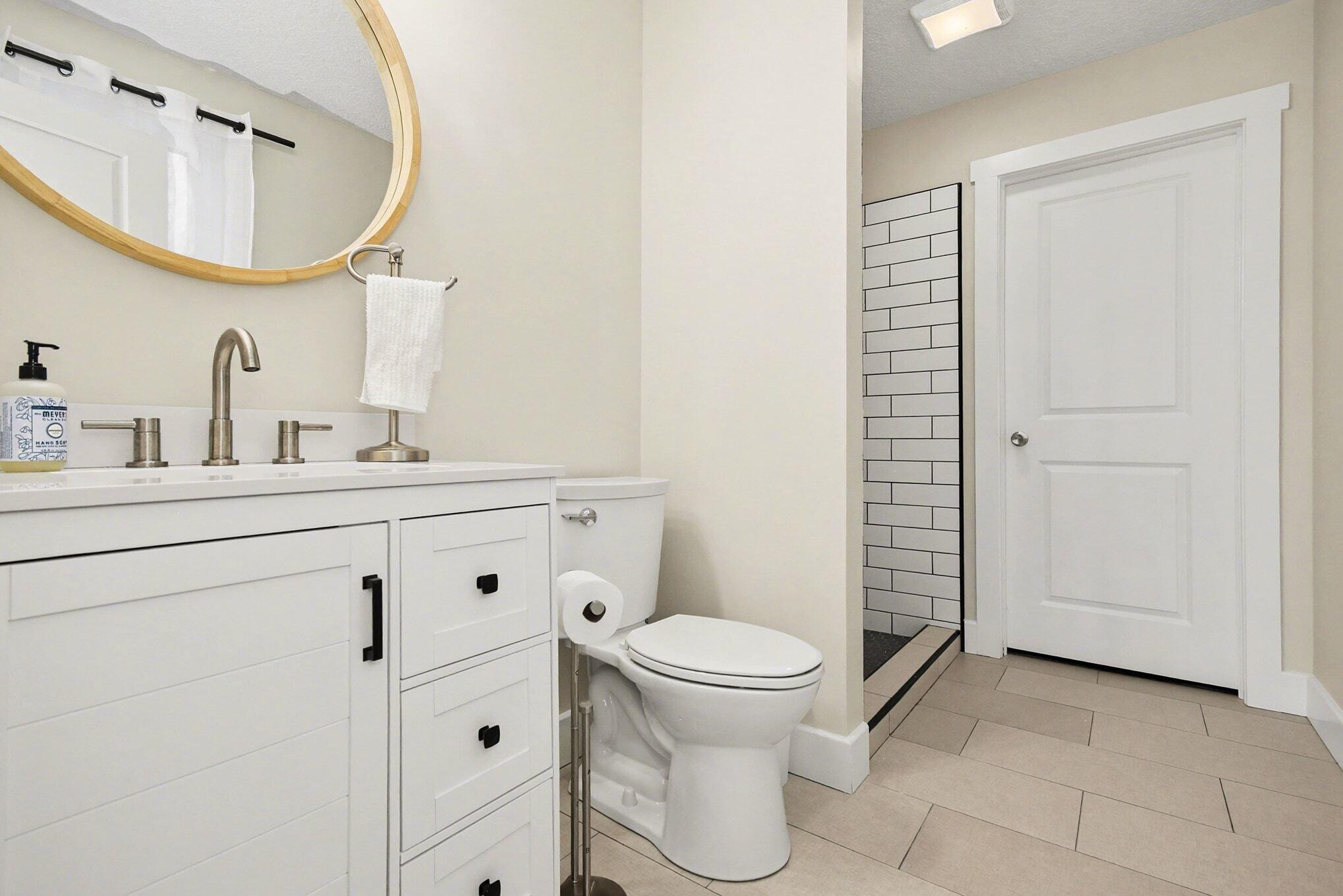 5317 Stellhorn Road Fort Wayne, IN 46815 - Photo 26 of 29 a bathroom with a toilet sink and a mirror