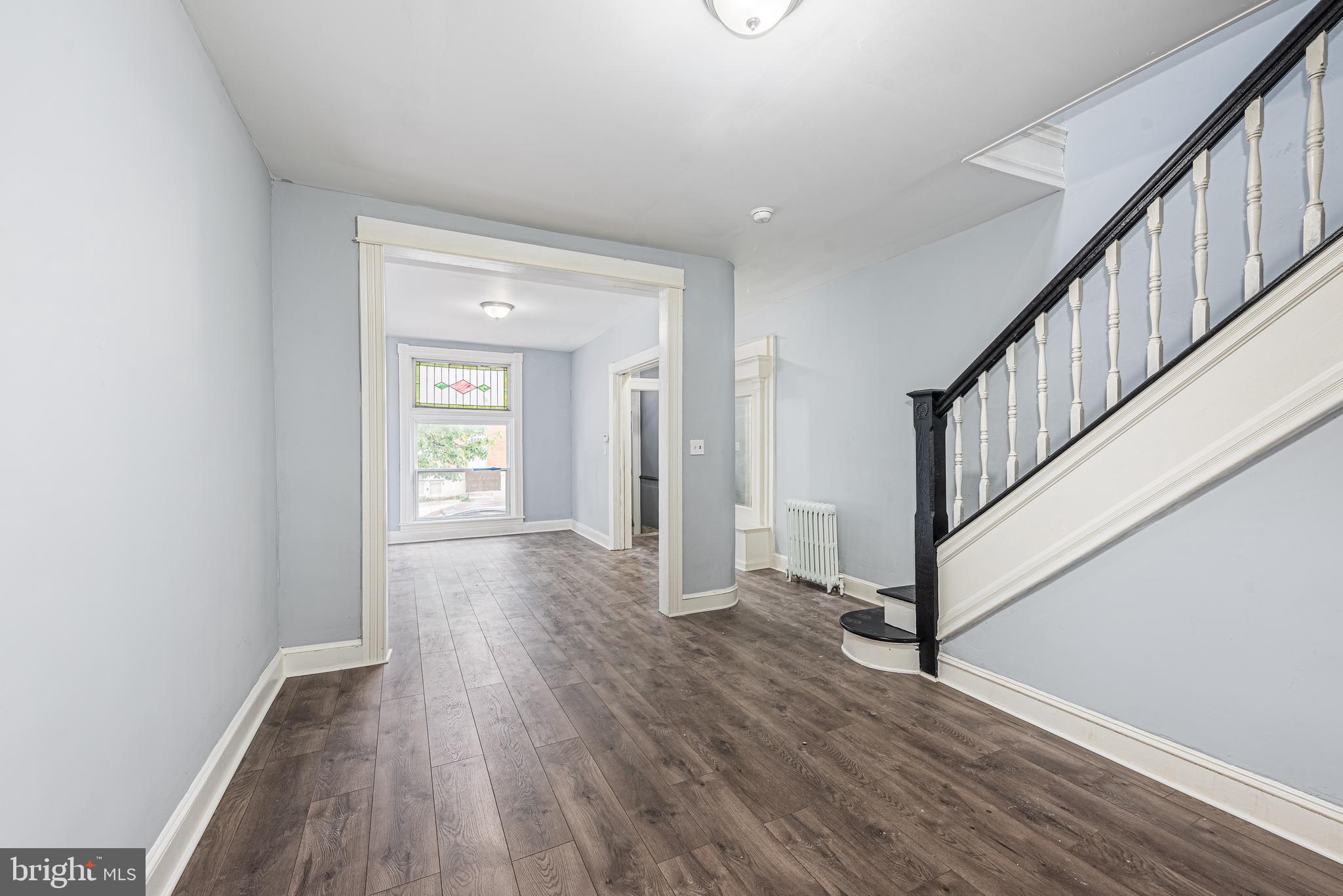 1624 Darley Avenue Baltimore, MD 21213 - Photo 14 of 28 a view of an entryway with wooden floor and stairs