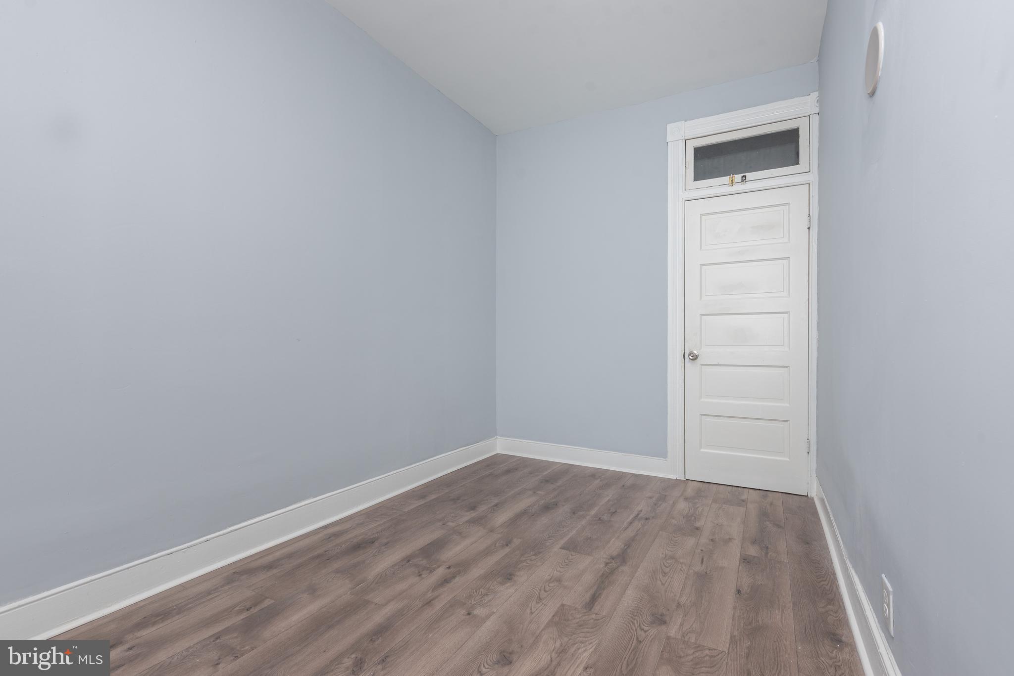 1624 Darley Avenue Baltimore, MD 21213 - Photo 21 of 28 wooden floor in an empty room