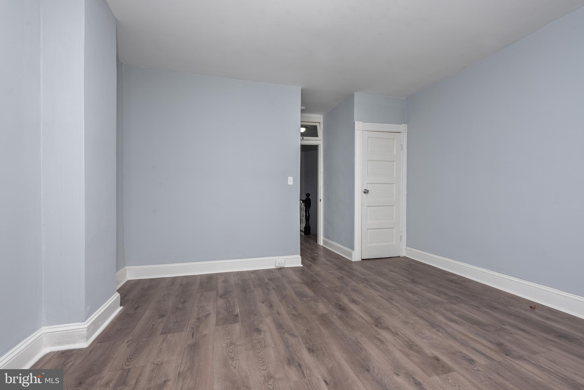 1624 Darley Avenue Baltimore, MD 21213 - Photo 25 of 28 a view of an empty room with wooden floor