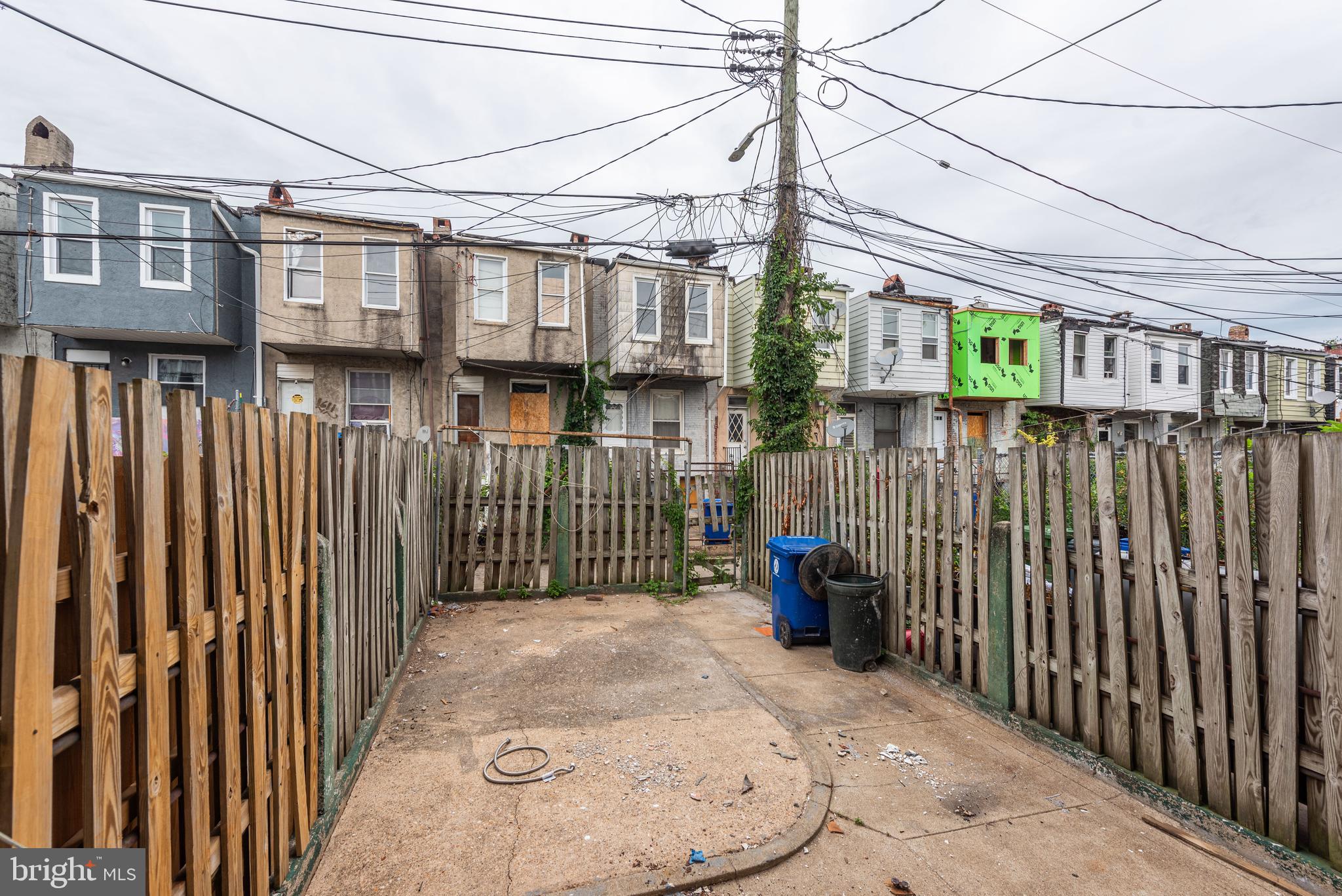 1624 Darley Avenue Baltimore, MD 21213 - Photo 26 of 28 a view of a street with wooden fence