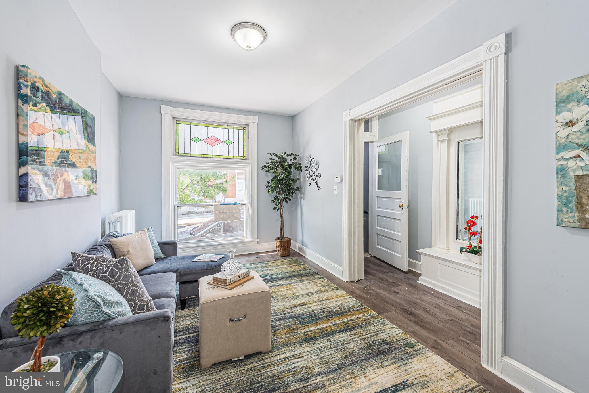 1624 Darley Avenue Baltimore, MD 21213 - Photo 3 of 28 a living room with furniture windows and a potted plant