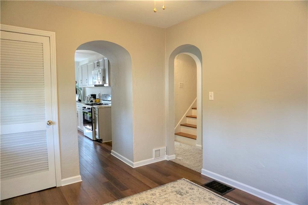 215 Freeport Road Butler, PA 16002 - Photo 10 of 25 a view of a hallway with wooden floor and a living room