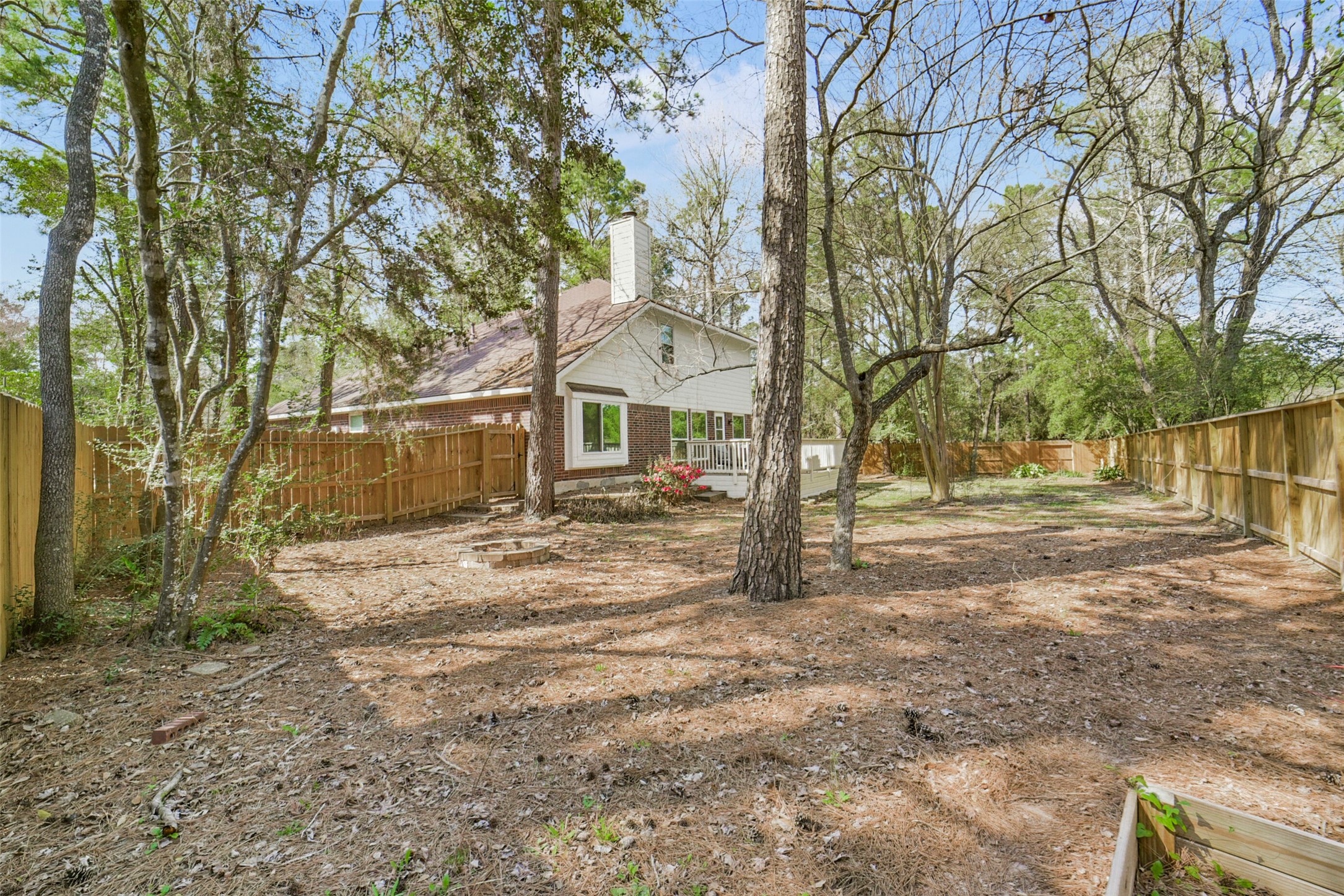 38 Tallow Hill Place Spring, TX 77382 - Photo 47 of 50 a view of a yard with a house and a large tree