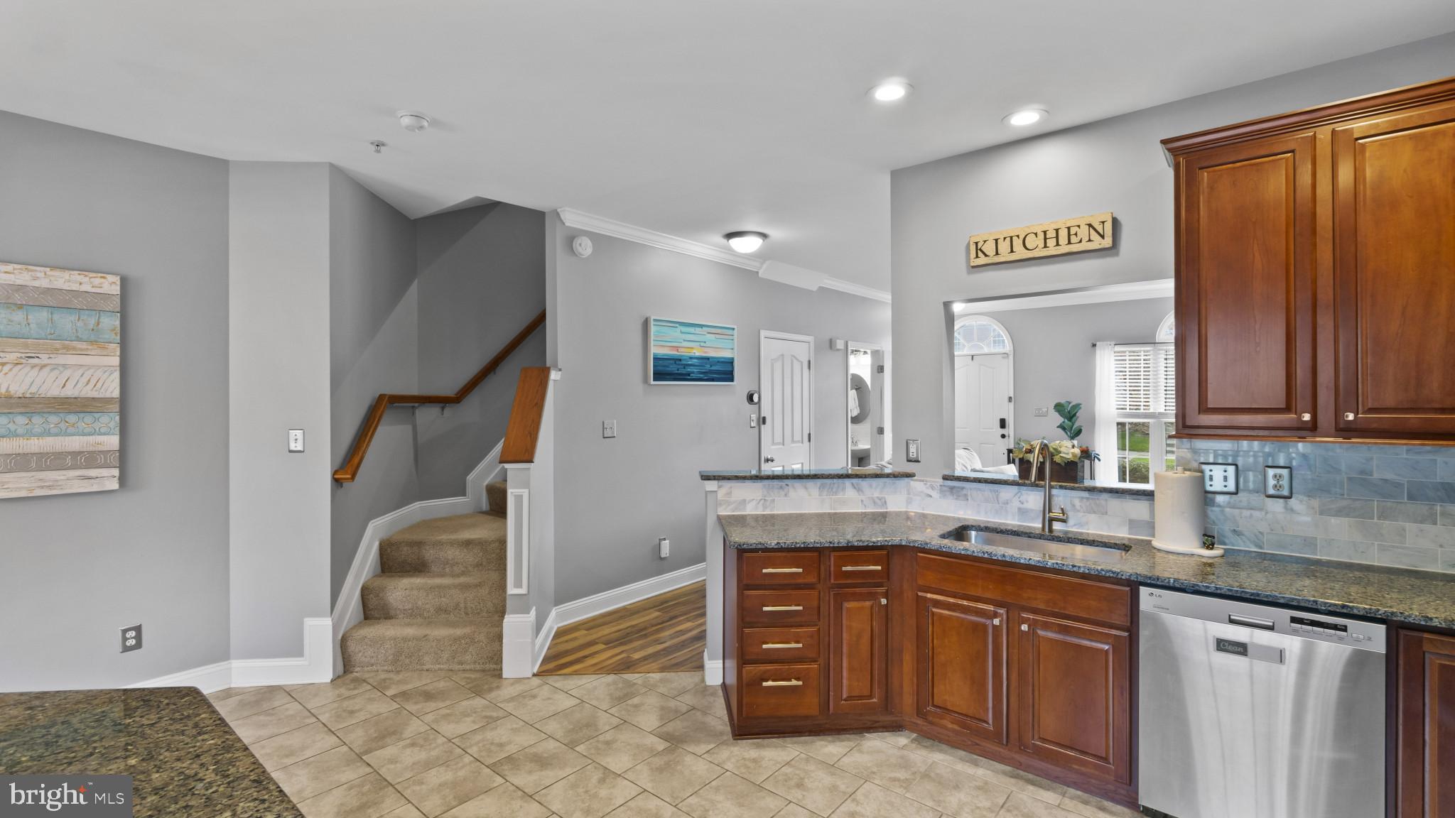526 Callander Way Abingdon, MD 21009 - Photo 12 of 40 a kitchen with granite countertop a sink cabinets and window