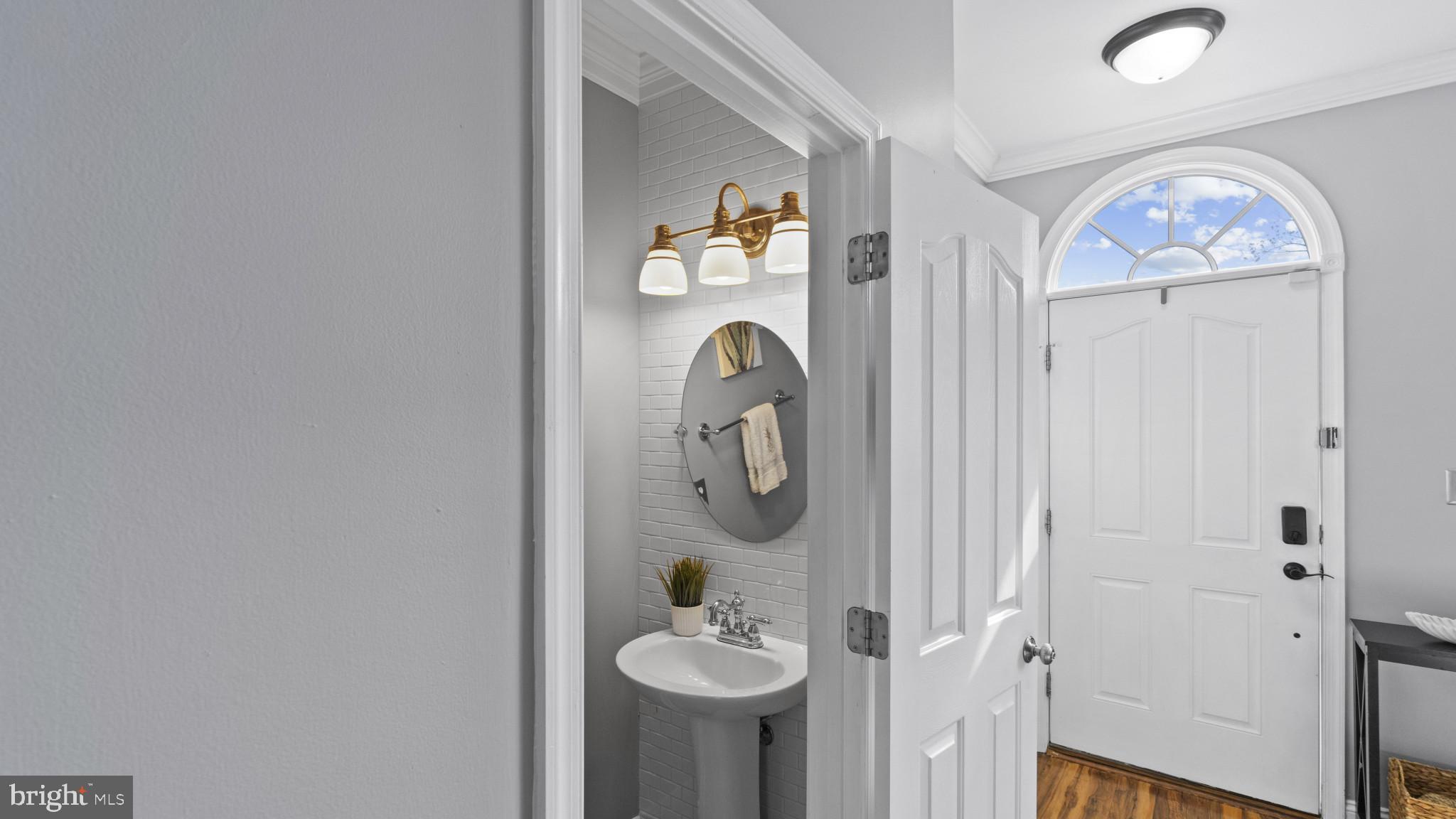 526 Callander Way Abingdon, MD 21009 - Photo 8 of 40 a bathroom with a mirror and a sink