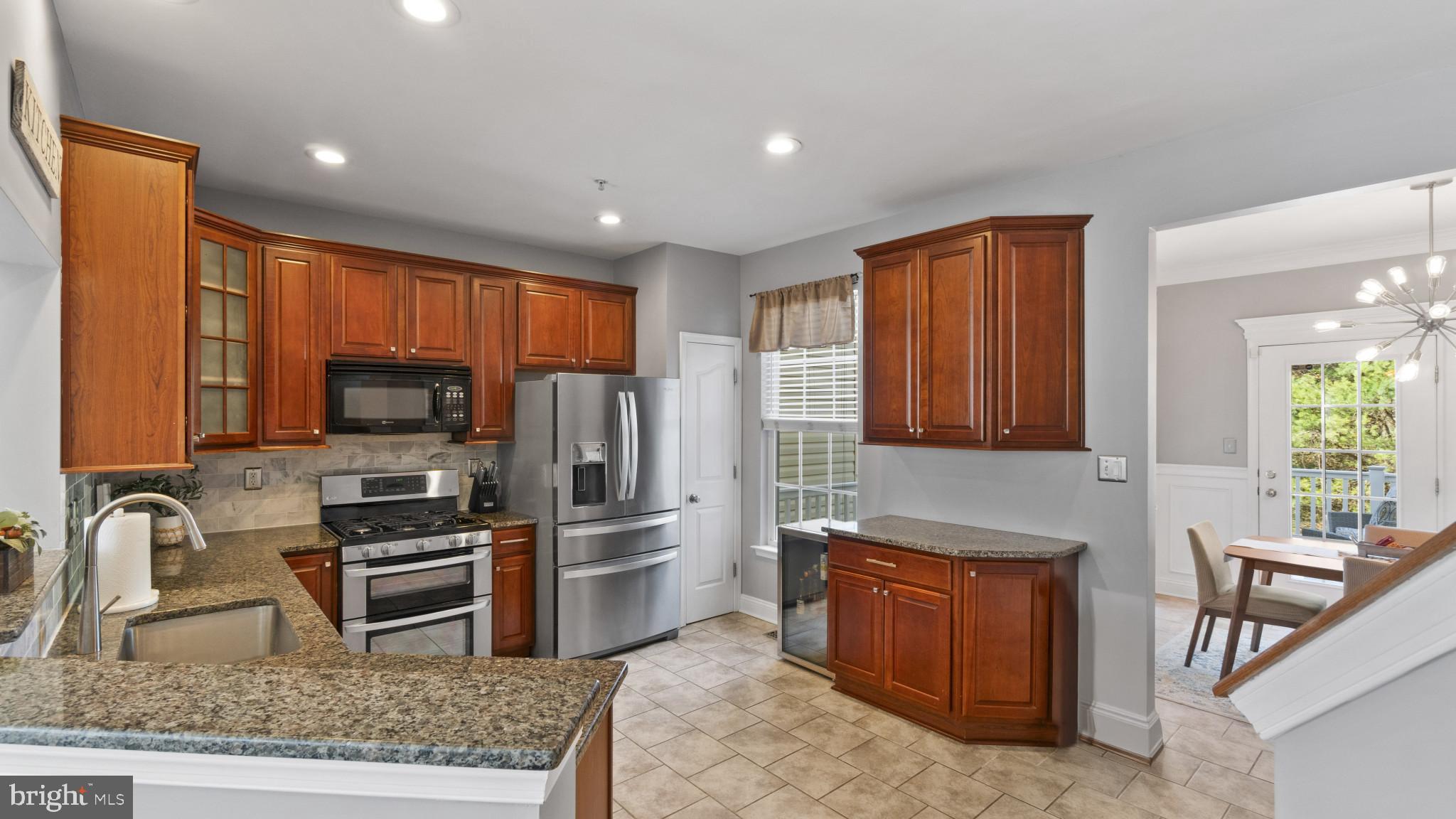 526 Callander Way Abingdon, MD 21009 - Photo 9 of 40 a kitchen with refrigerator cabinets and a sink