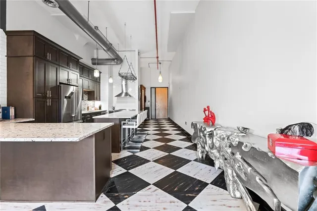 a view of a very nice looking dining room with a table and chairs