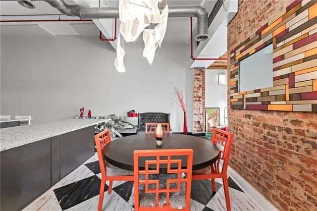 a dining room with a table and chairs