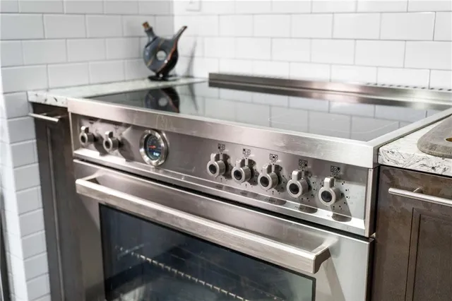 a kitchen with a sink and a stove