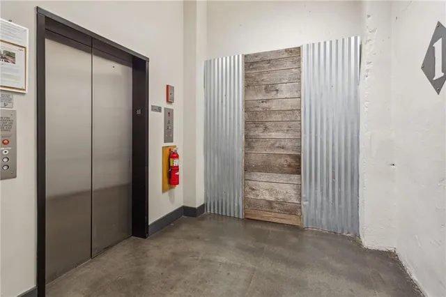 a view of a balcony with chairs and wooden floor