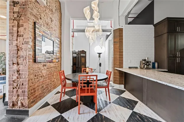 a dining room with furniture and window
