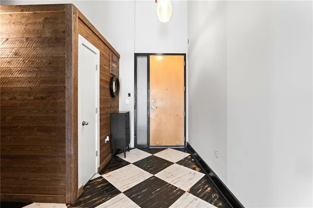a kitchen with granite countertop a sink stove and refrigerator